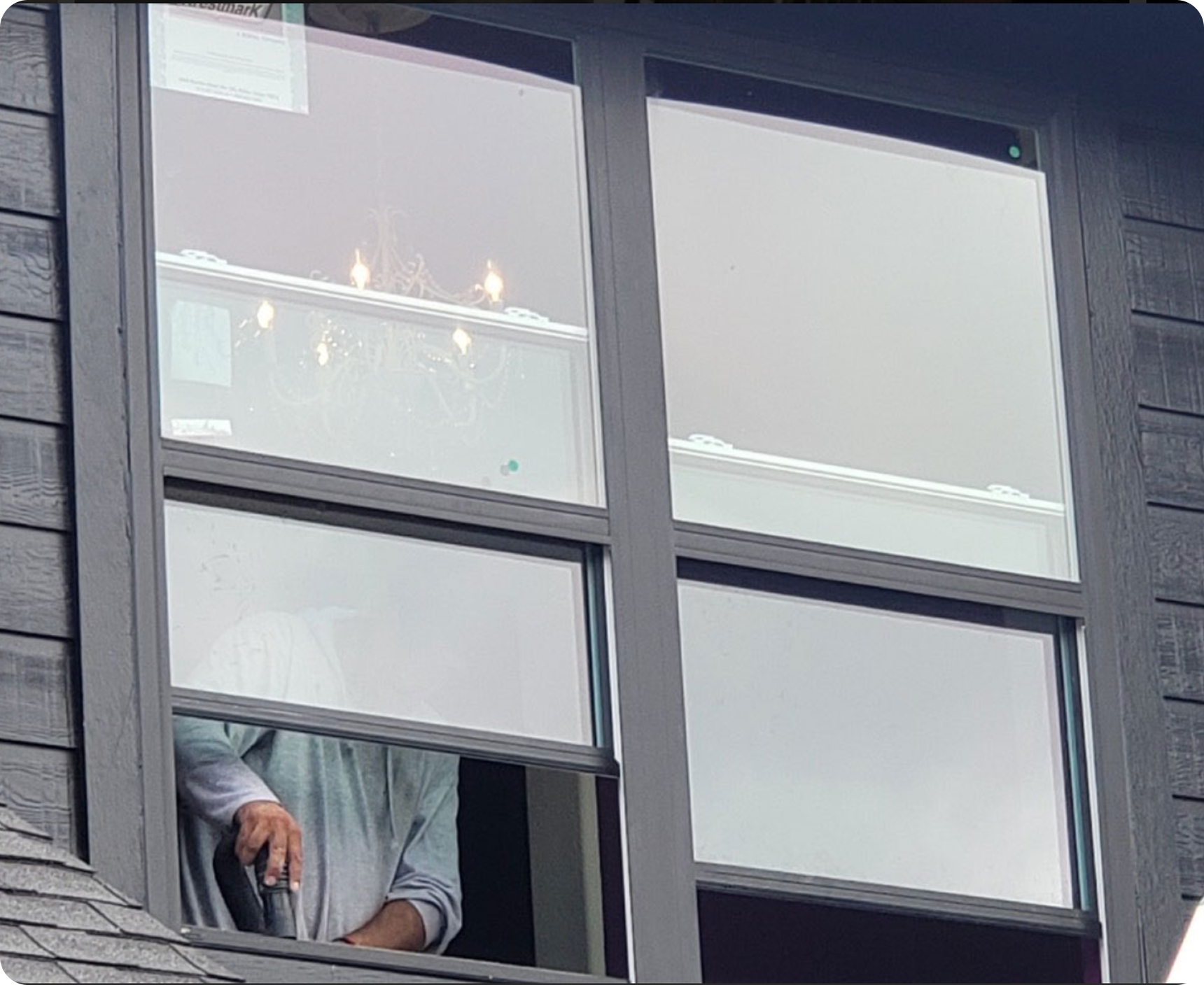 Person visible through a house window.