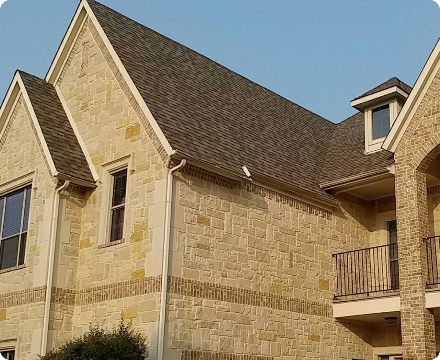 Stone house with steep gabled roof.